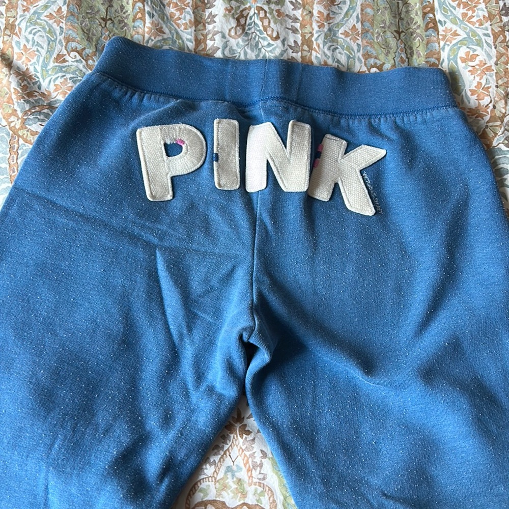Pink sweat pants with cuffed ankles